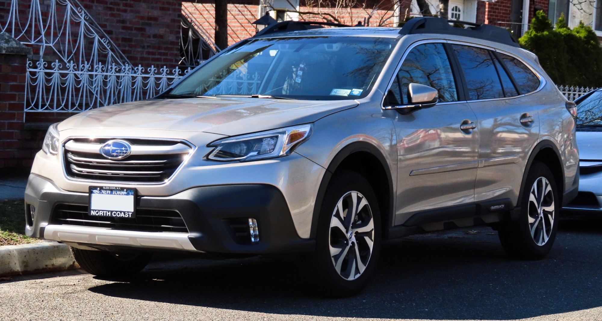 2020 Subaru Outback AWD, champagne/gold, front 3/4, residential street