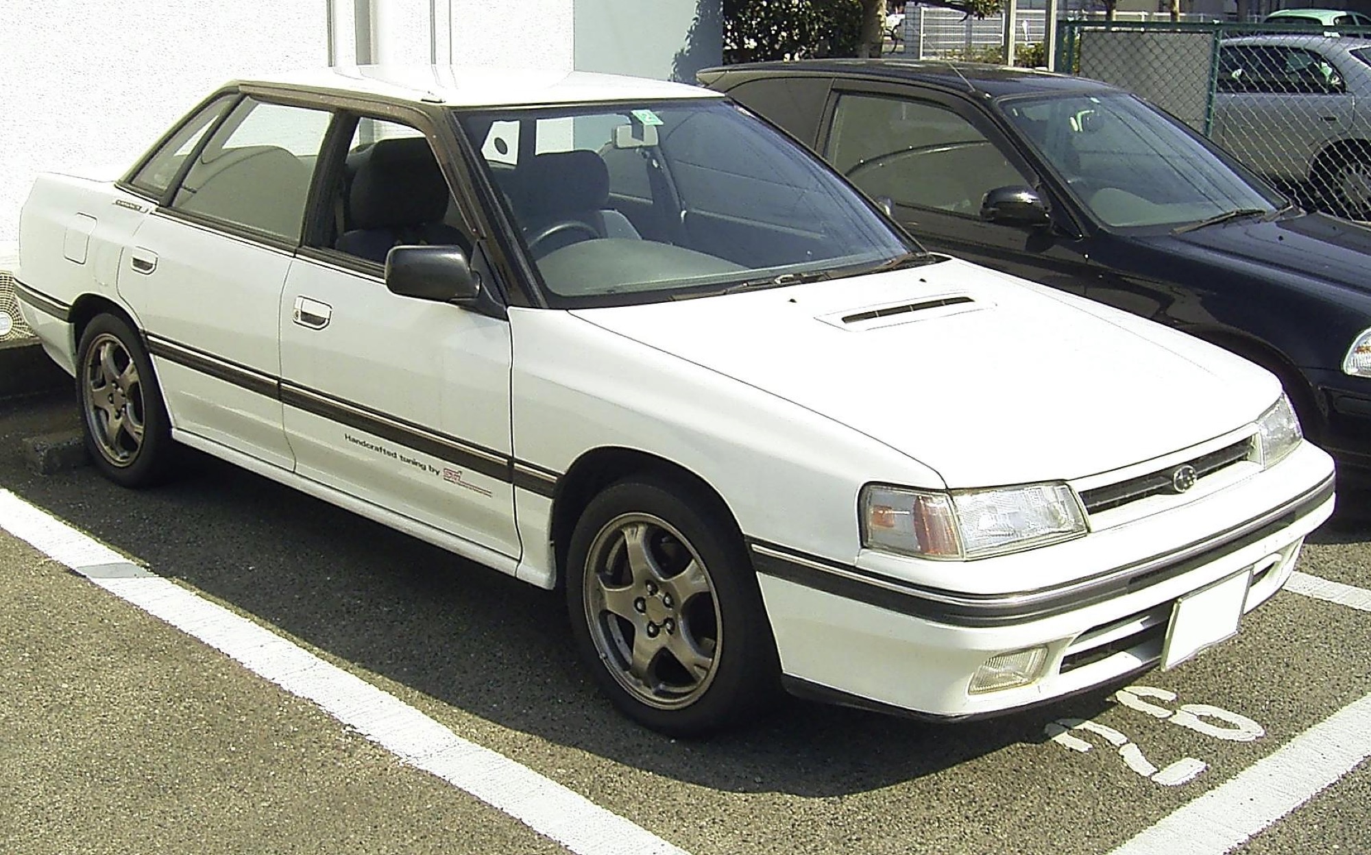 Subaru Legacy RS-RA, white, JDM, "Handcrafted tuning by STI" decal — STI's first-ever prepared production vehicle